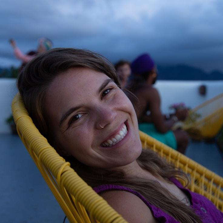 Alexandra Lee, Lead Design Curator at Lumi Spectravo, reviewing corporate floral arrangements